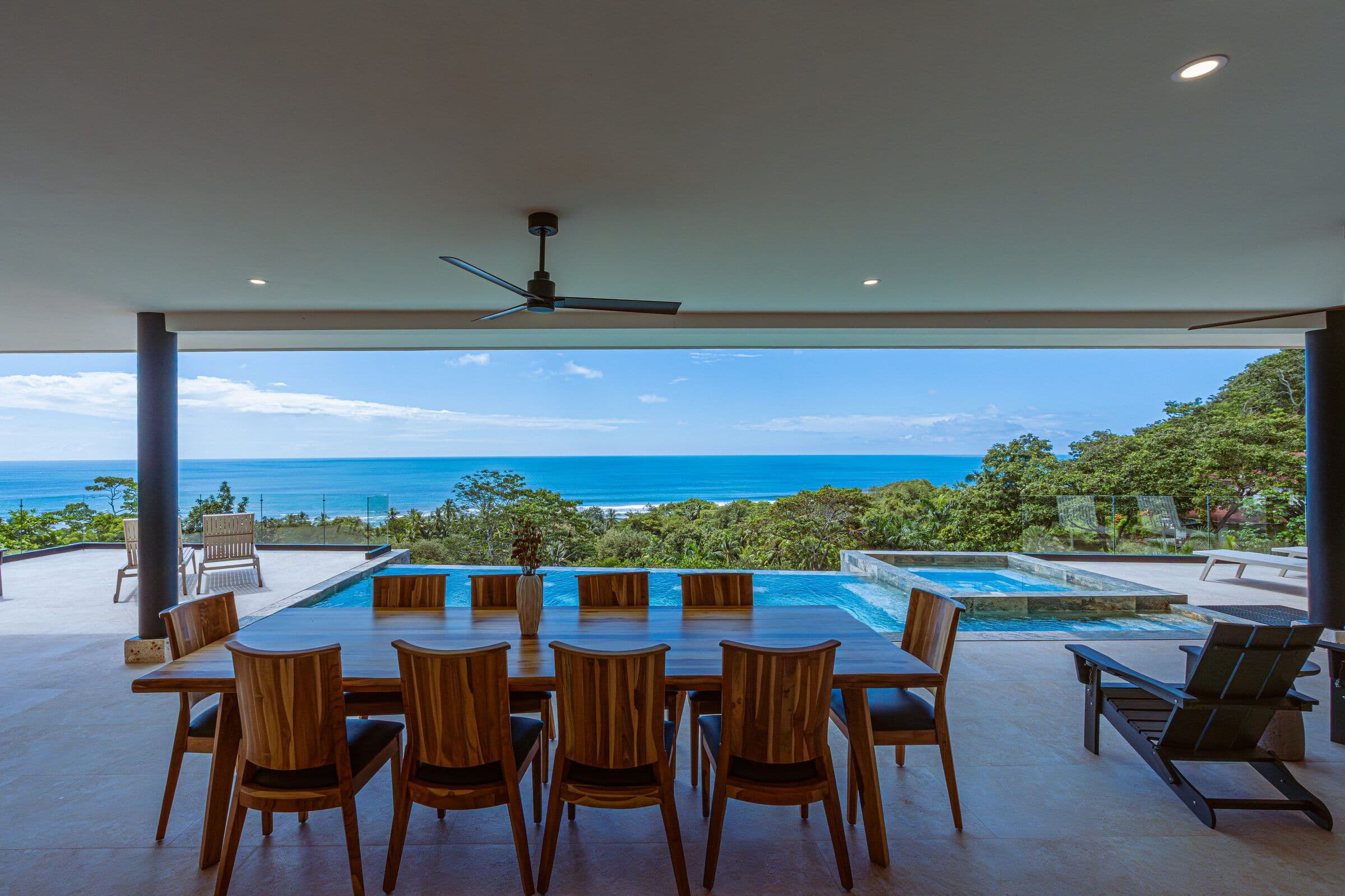 Dining table with pool and ocean view