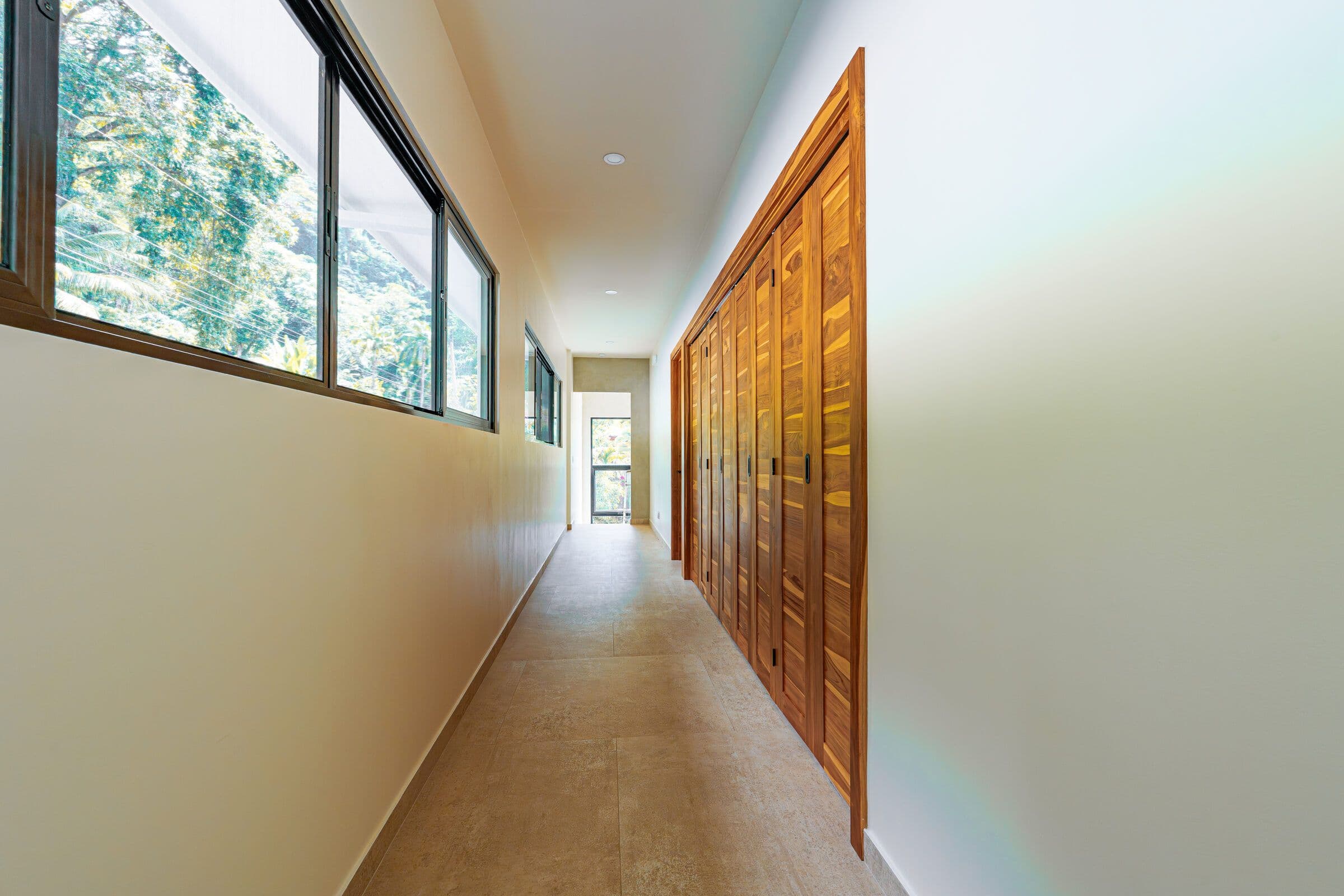 Sloth room with green accent and ocean balcony