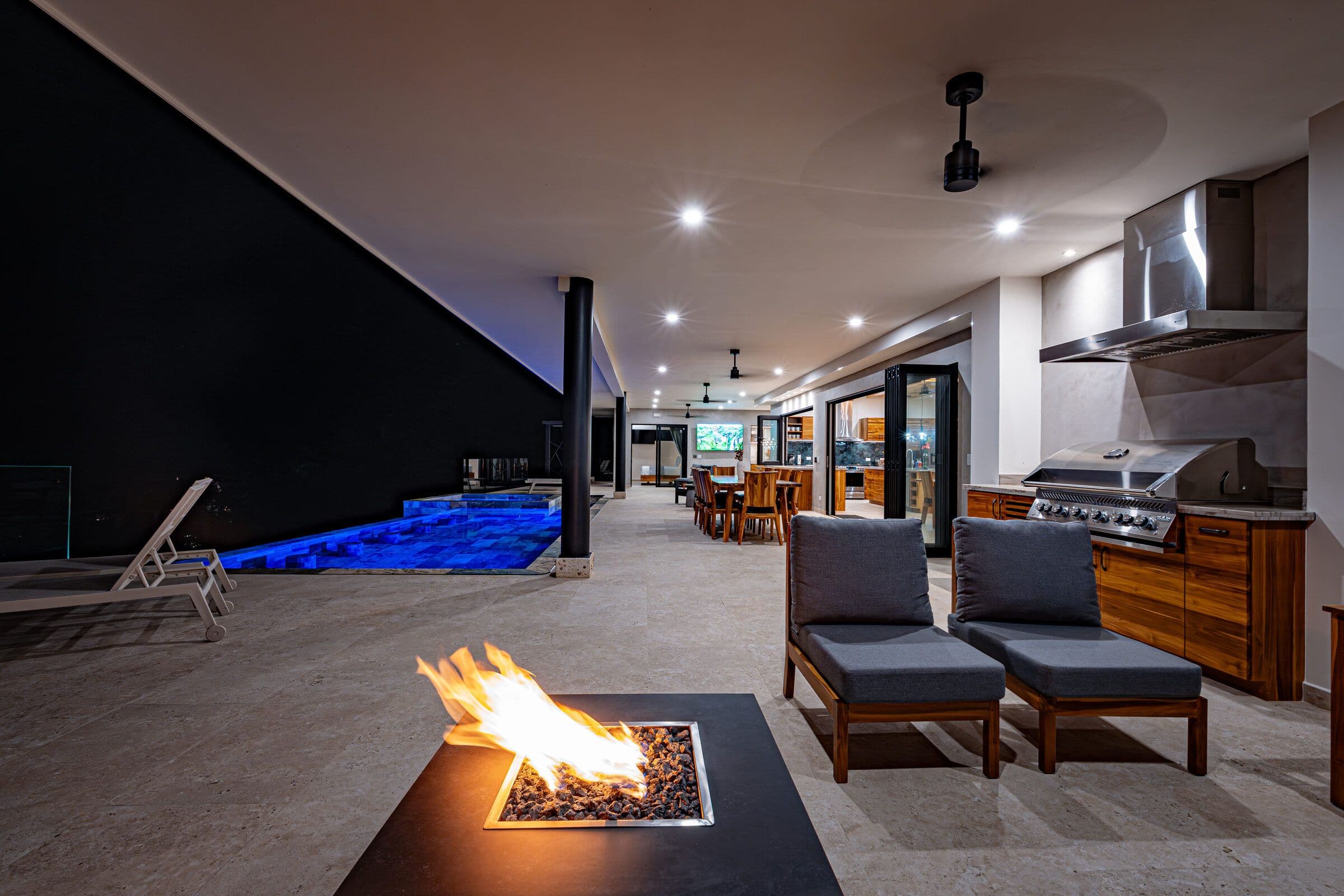 Firepit and BBQ area at night