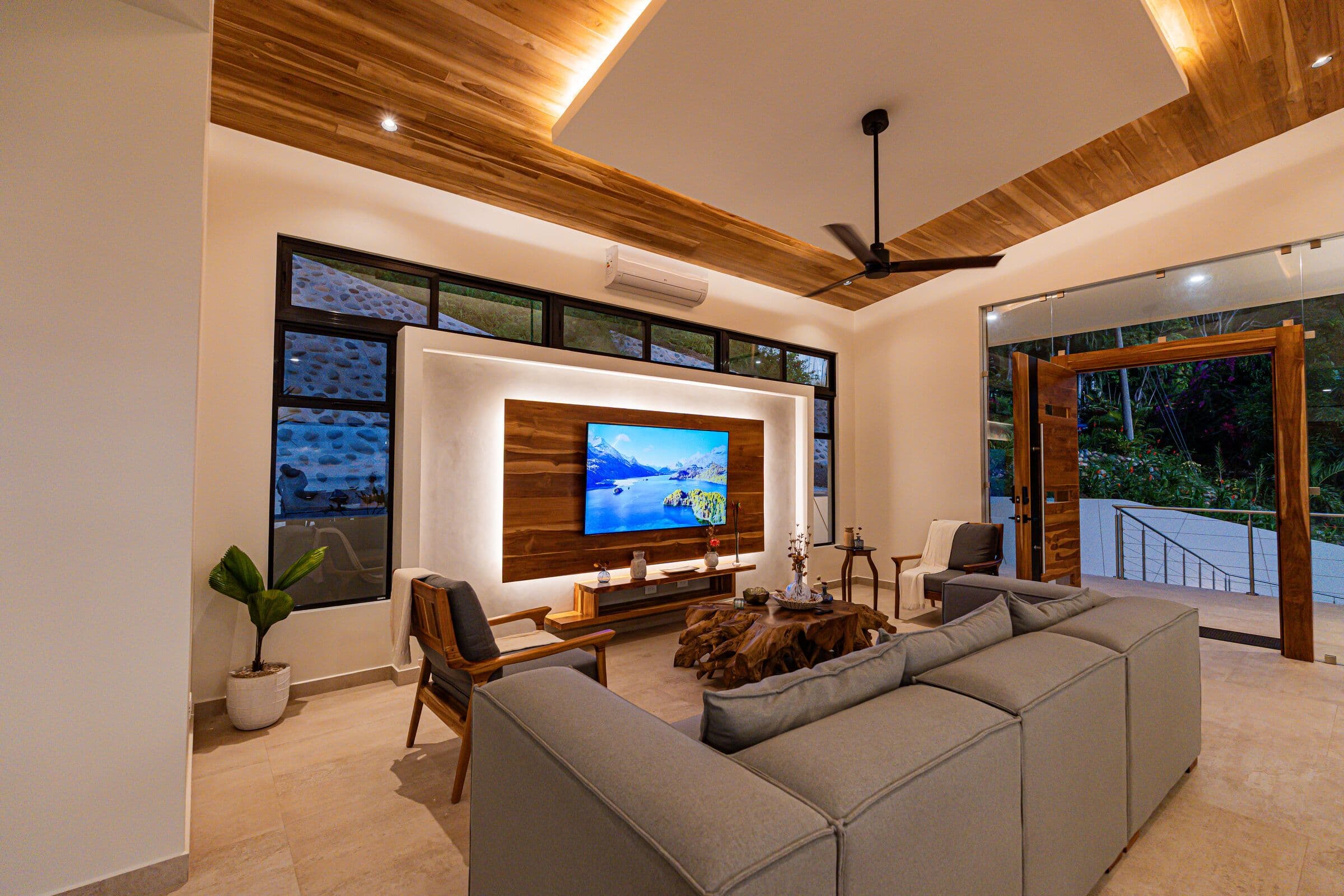 TV room with recessed wood panel