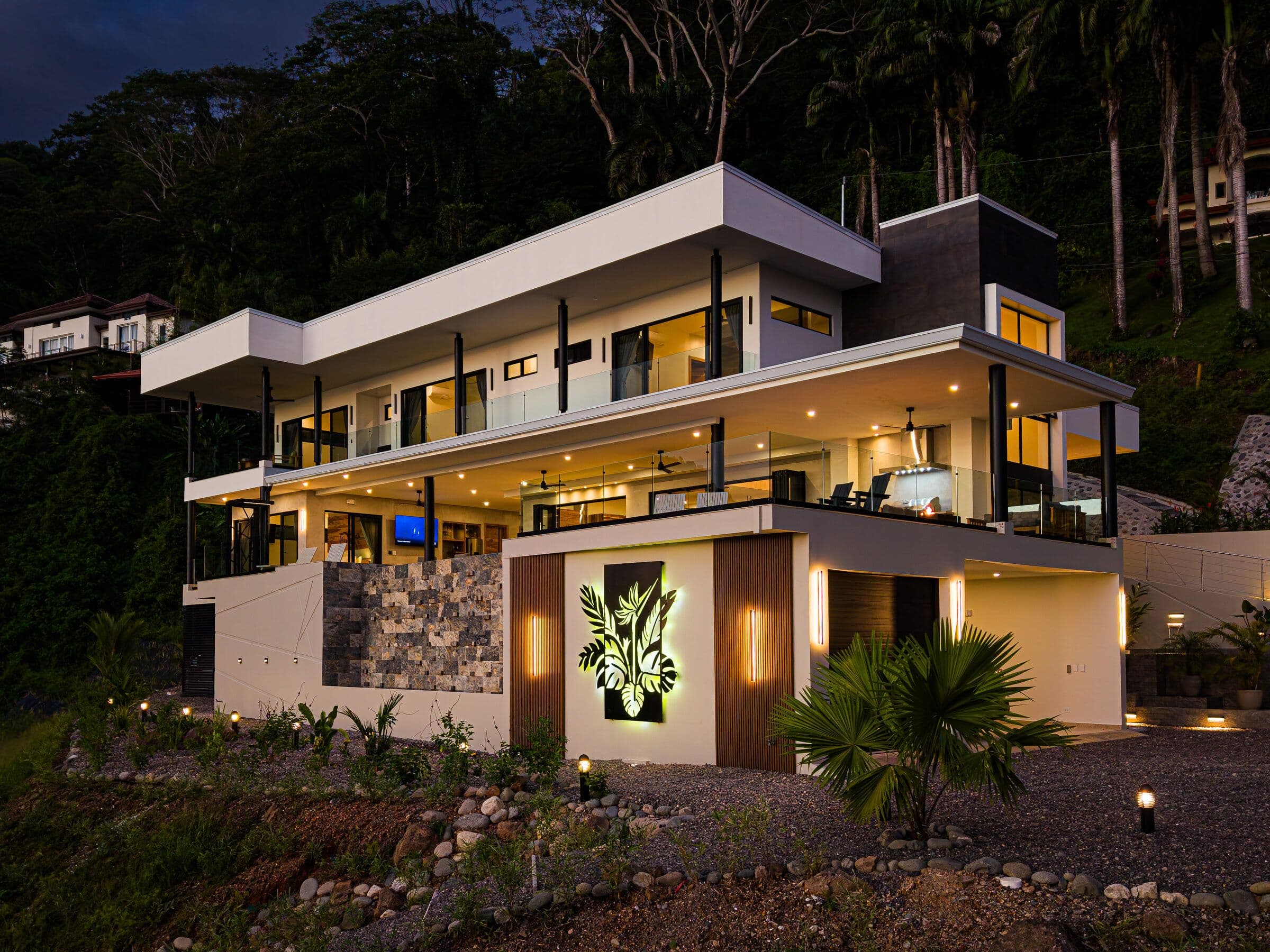 Night facade with all lights and blue pool